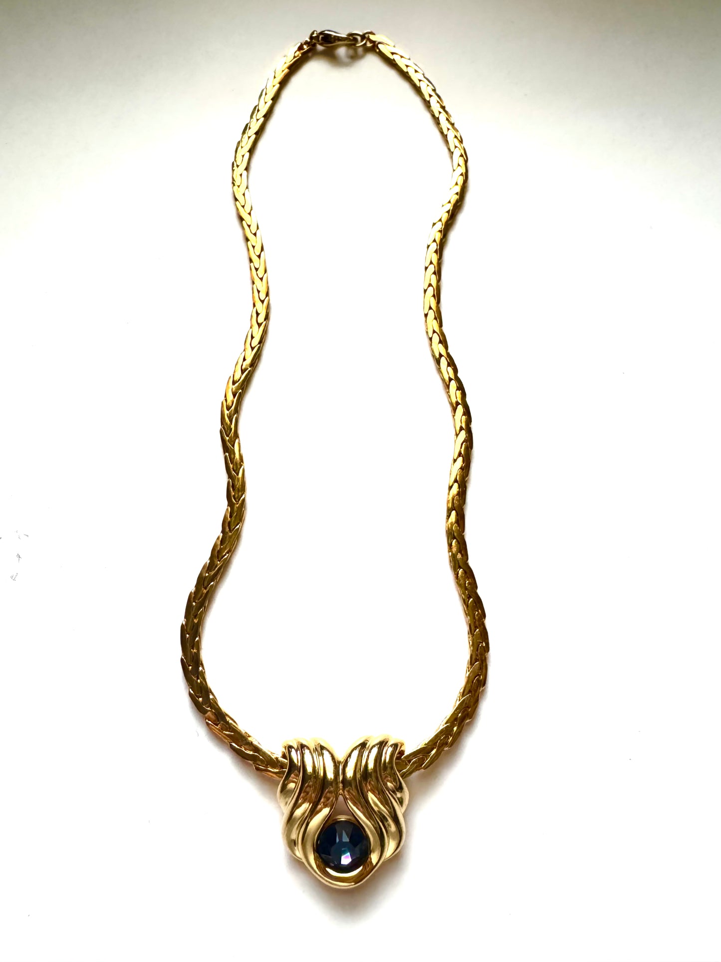 Vintage Nolan Miller Gold-Tone Pendant Necklace with Sculptural Knot Motif & Blue Stone
