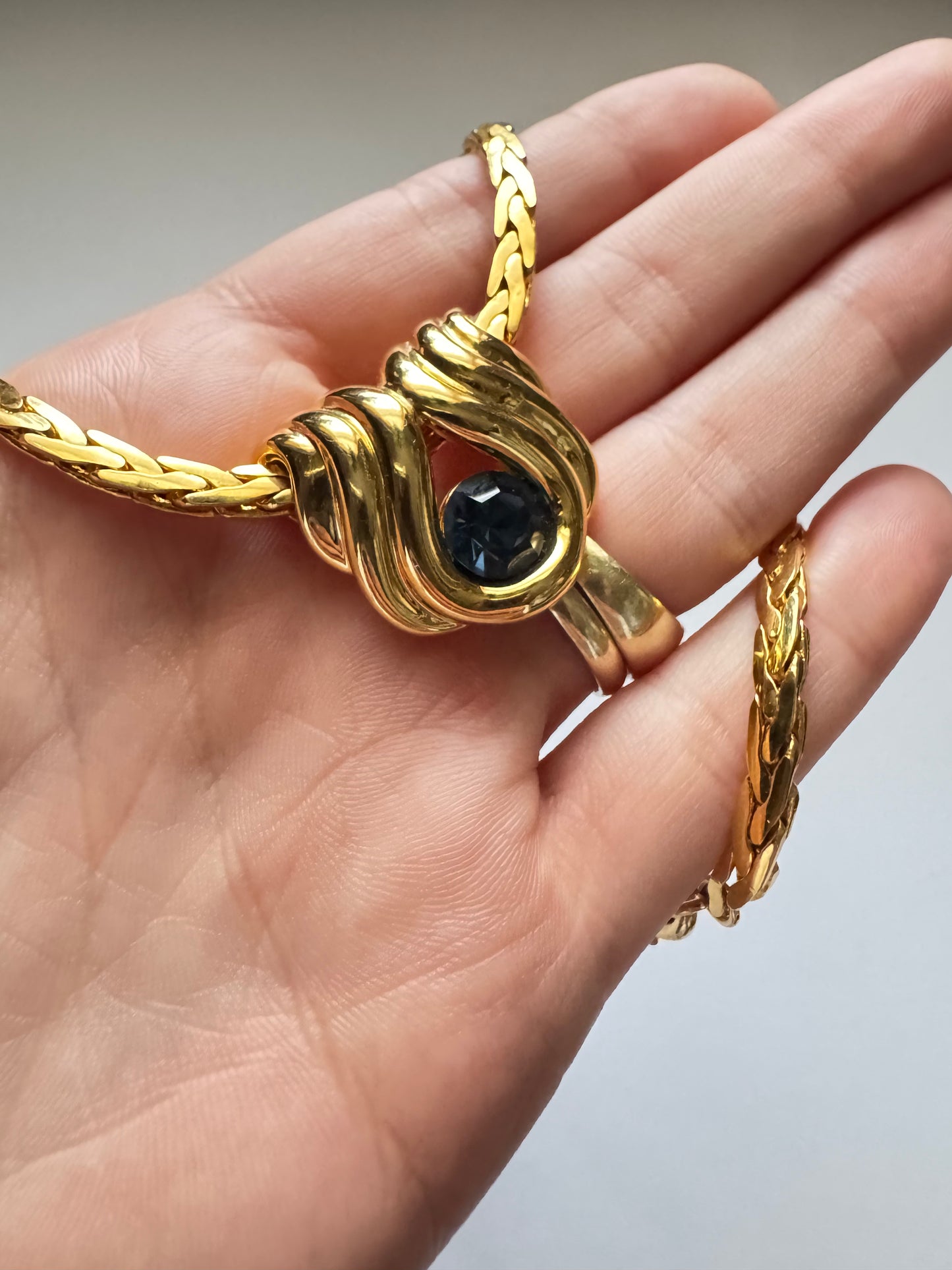 Vintage Nolan Miller Gold-Tone Pendant Necklace with Sculptural Knot Motif & Blue Stone