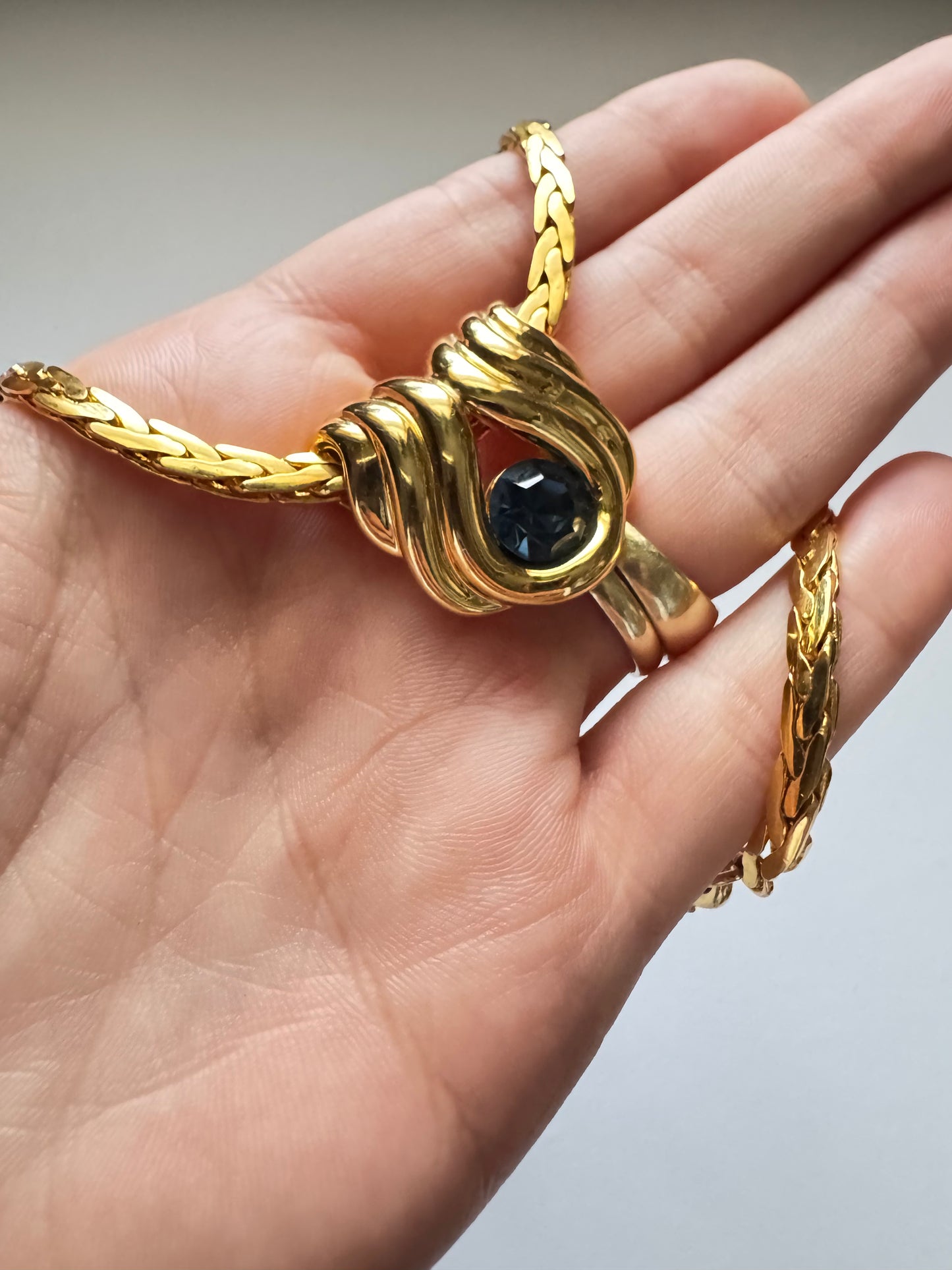 Vintage Nolan Miller Gold-Tone Pendant Necklace with Sculptural Knot Motif & Blue Stone