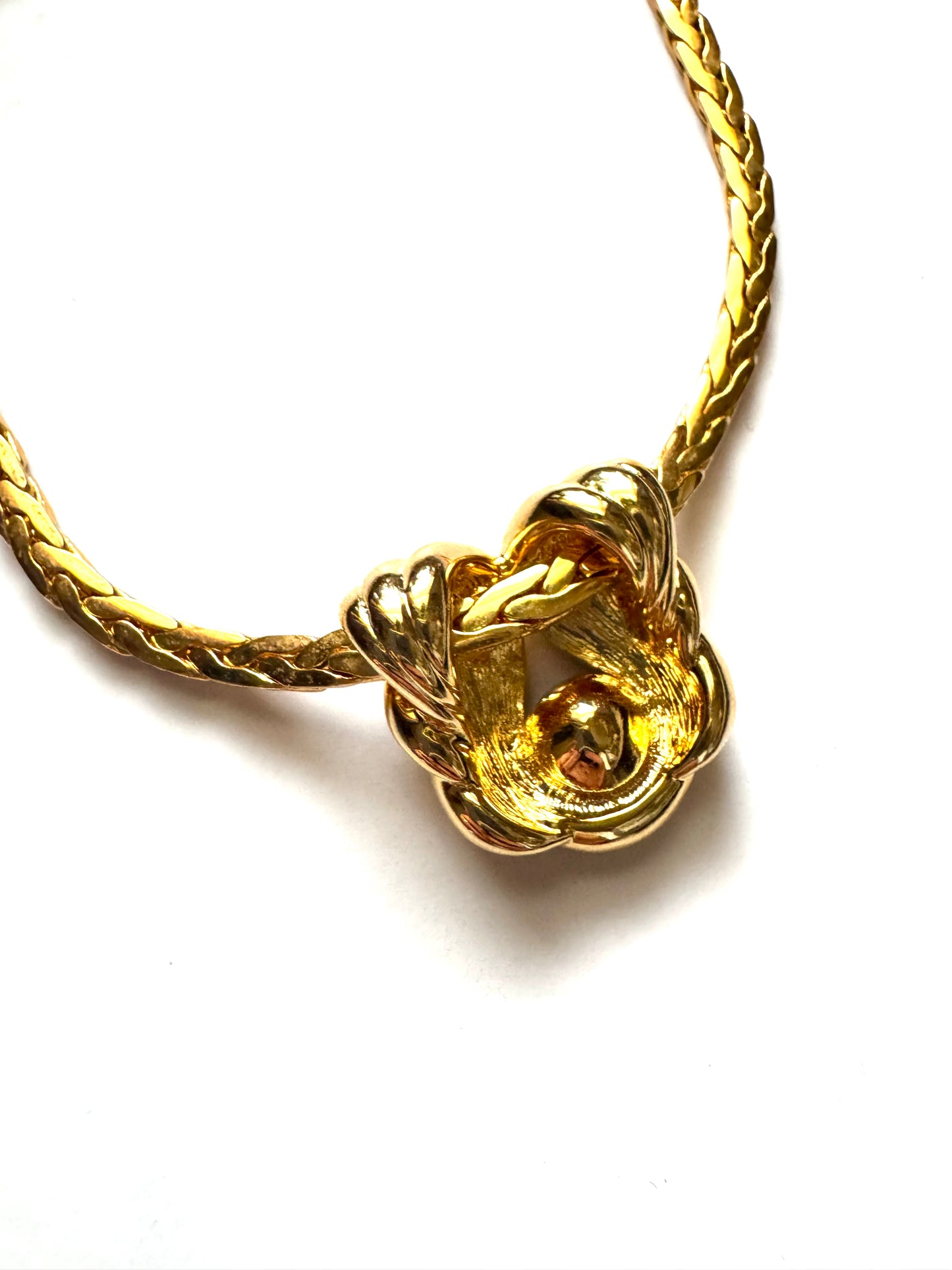 Vintage Nolan Miller Gold-Tone Pendant Necklace with Sculptural Knot Motif & Blue Stone